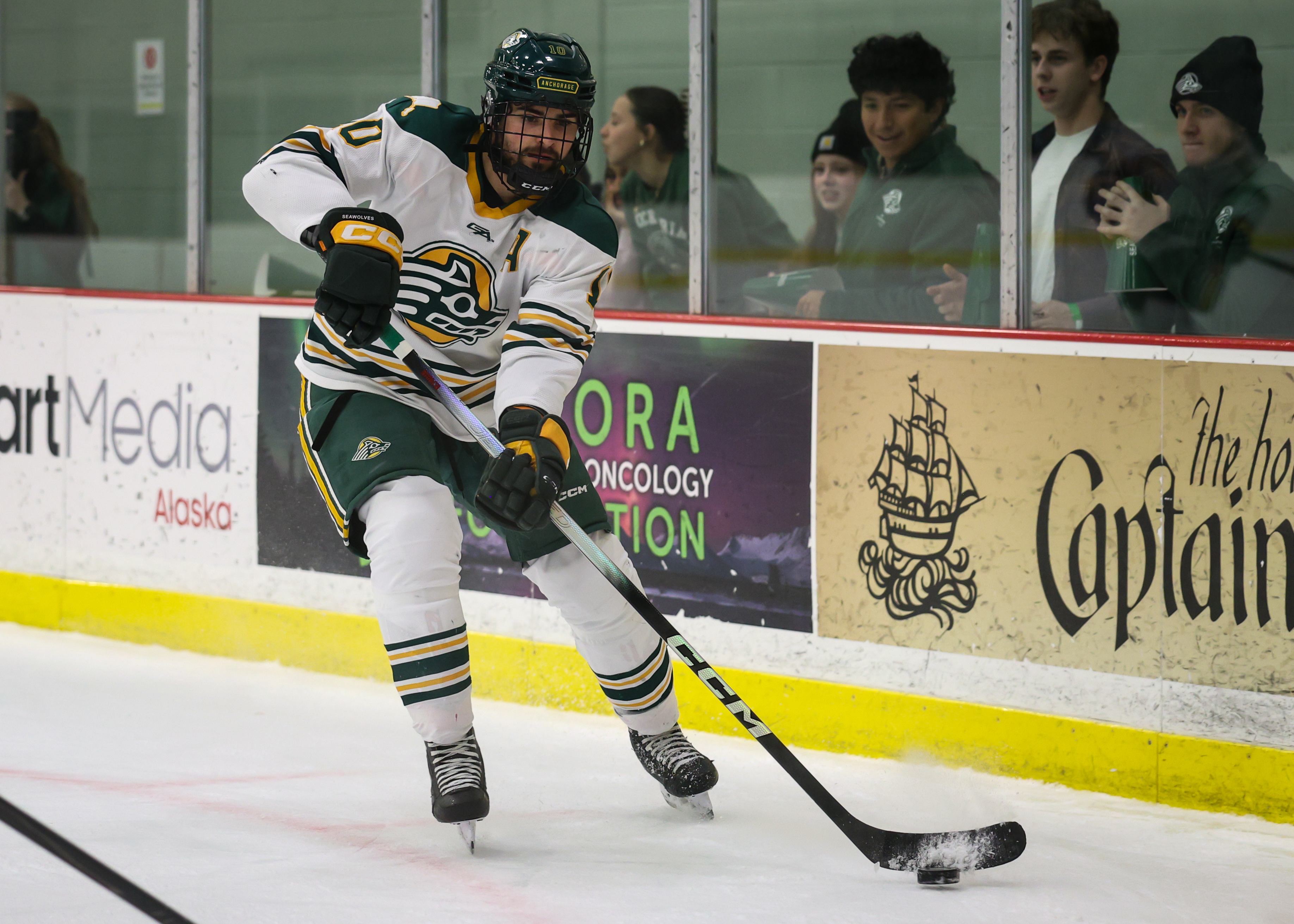 ABG Elite Skills coach skating with the puck during NCAA play